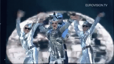 Group Dancing On Stage Under Moon GIF