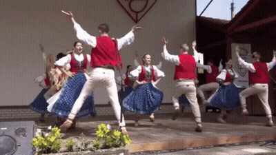 Group Dancing On Stage With A Sign GIF