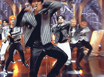 Group Dancing On Stage With Heliapae Text GIF