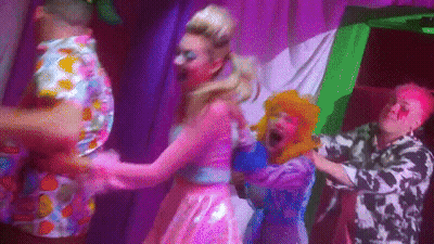 Group Dancing On Stage With Purple Lights GIF