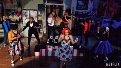 Group Dancing With Netflix Logo