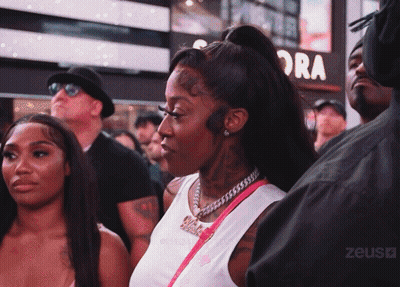 Group Gathered In Front Of Sign Saying Ora GIF
