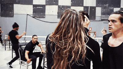 Group Gathered One Has Letter O On Chest GIF