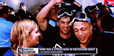 Group Gathered Under Giancarlo Stanton Banner GIF