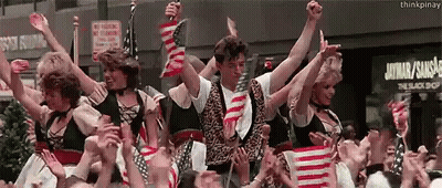 Group Holding American Flags At The Black Shop Sign GIF