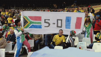 Group Holding Banner Saying 5-0 GIF