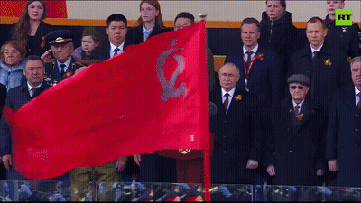 Group Holding Red Flag With E GIF
