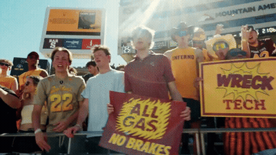 Group Holding Signs Saying All Gas No Brakes GIF