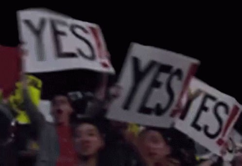 Group Holding Signs Saying Yes GIF