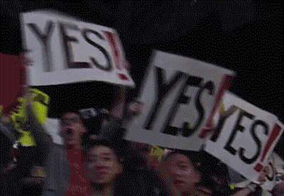 Group Holding Signs Saying Yes GIF