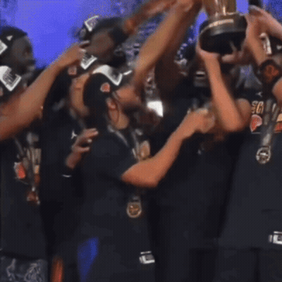 Group Holding Trophy, Person In Crying Face Shirt GIF