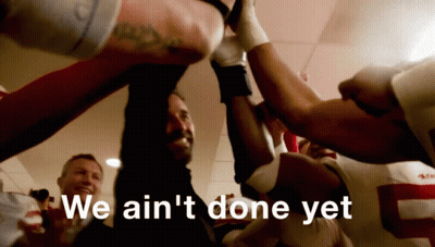 Group Huddled Together We Ain't Done Yet GIF