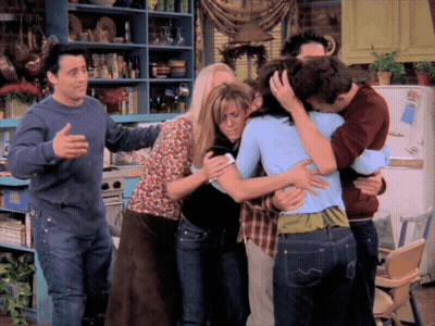 Group Hugging In Front Of LG Refrigerator GIF