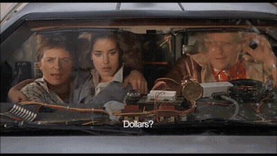 Group In Car With Dollars On Screen GIF