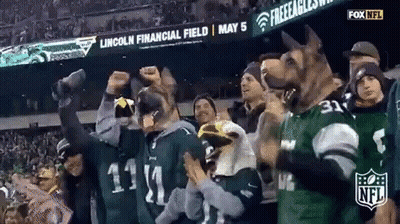 Group In Dog Masks Watching Football GIF