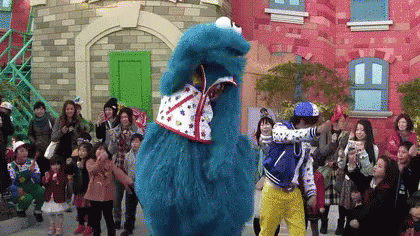 Group In Front Of Cookie Monster Costume GIF