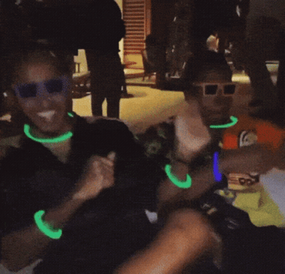 Group In Glow In The Dark Shirts And Sunglasses GIF