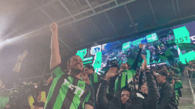 Group In Green And Black Striped Shirts With Letter T GIF