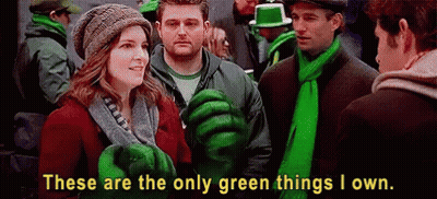 Group In Green Clothes And Scarves In Crowd GIF