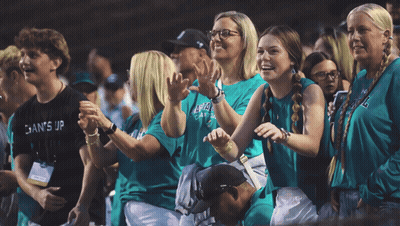 Group In Green Shirts Saying Gains GIF
