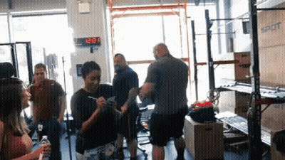 Group In Gym With 12:20 Clock GIF