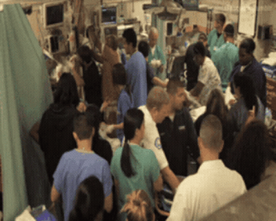 Group In Hospital Room With Police Officer GIF