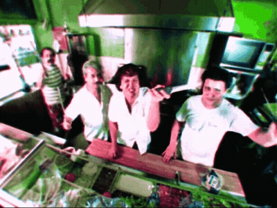 Group In Kitchen One Wearing White Shirt Saying A GIF
