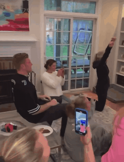 Group In Living Room With Number 7 Jersey GIF