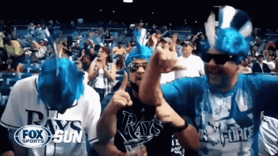 Group In Rays Shirts Dancing In Crowd GIF