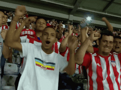 Group In Red And White Striped USA Shirts GIF