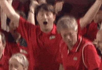 Group In Red Shirts Cheering In Stadium GIF