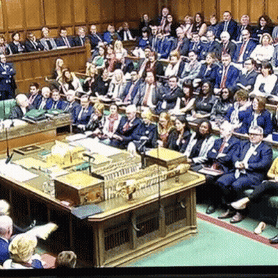 Group In Room With Parliament Podium GIF