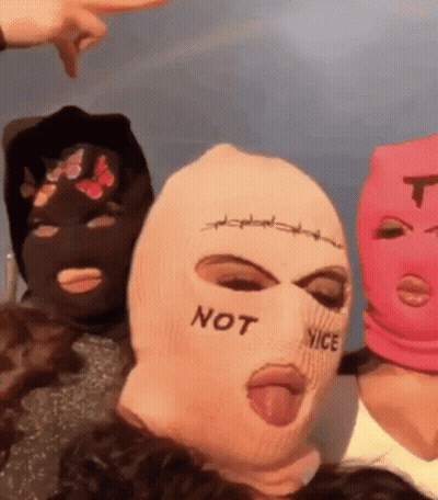 Group In Ski Masks Posing For Picture GIF