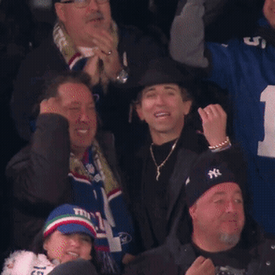 Group In Stadium Wearing NY Hats And Scarves GIF