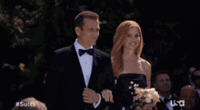 Group In Tuxedos And Bow Ties In Front Of US Sign GIF