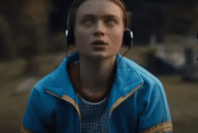 Group Kneeling In Park One In Blue Jacket GIF