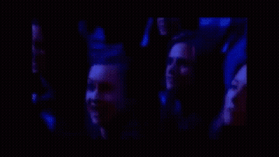 Group Laughing Together In Dark Room GIF