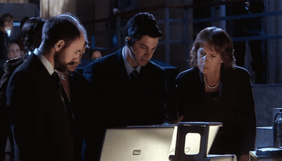 Group Looking At Dell Laptop GIF