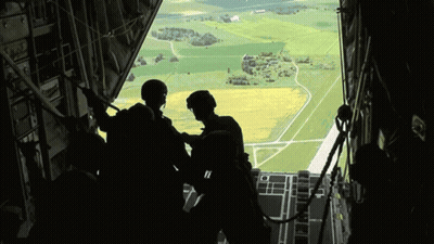 Group Looking Out Plane Window GIF