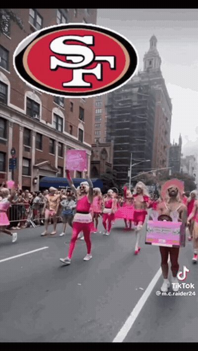 Group Marching Down Street With San Francisco 49Ers Logo GIF