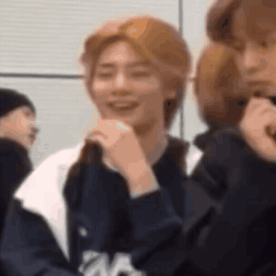 Group Member Smiling And Covering Mouth GIF