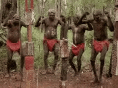 Group Of Aboriginal Men Dancing In The Woods GIF