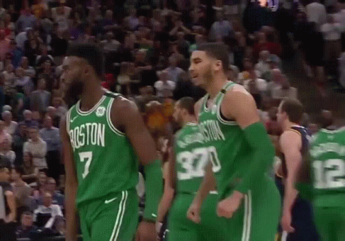 Group Of Basketball Players In Green On Court GIF