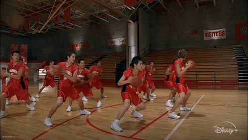 Group Of Basketball Players In Red Uniforms With Number 23 GIF