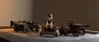 Group Of Cannons On Wooden Table GIF