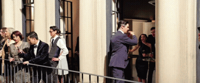Group Of Cats Standing In A Row With Paws Up GIF