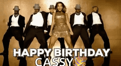 Group Of Dancers Dancing In Front Of Woman In Dress GIF