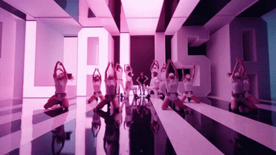 Group of Dancers Performing in Front of Large S