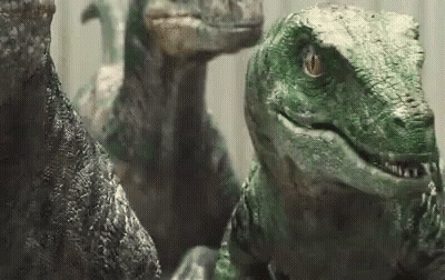 Group Of Dinosaurs Looking At Camera GIF