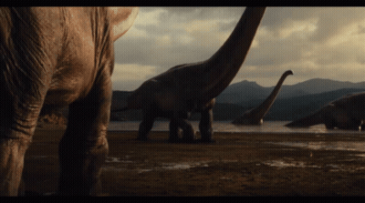 Group Of Dinosaurs Near Lake GIF